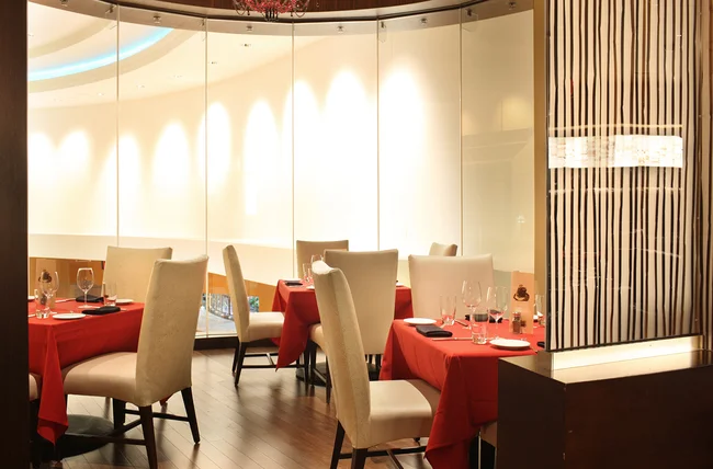 Elegant restaurant interior with round tables and stylish decor