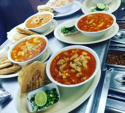 Hearty Mexican pozole served with tortillas and fresh toppings