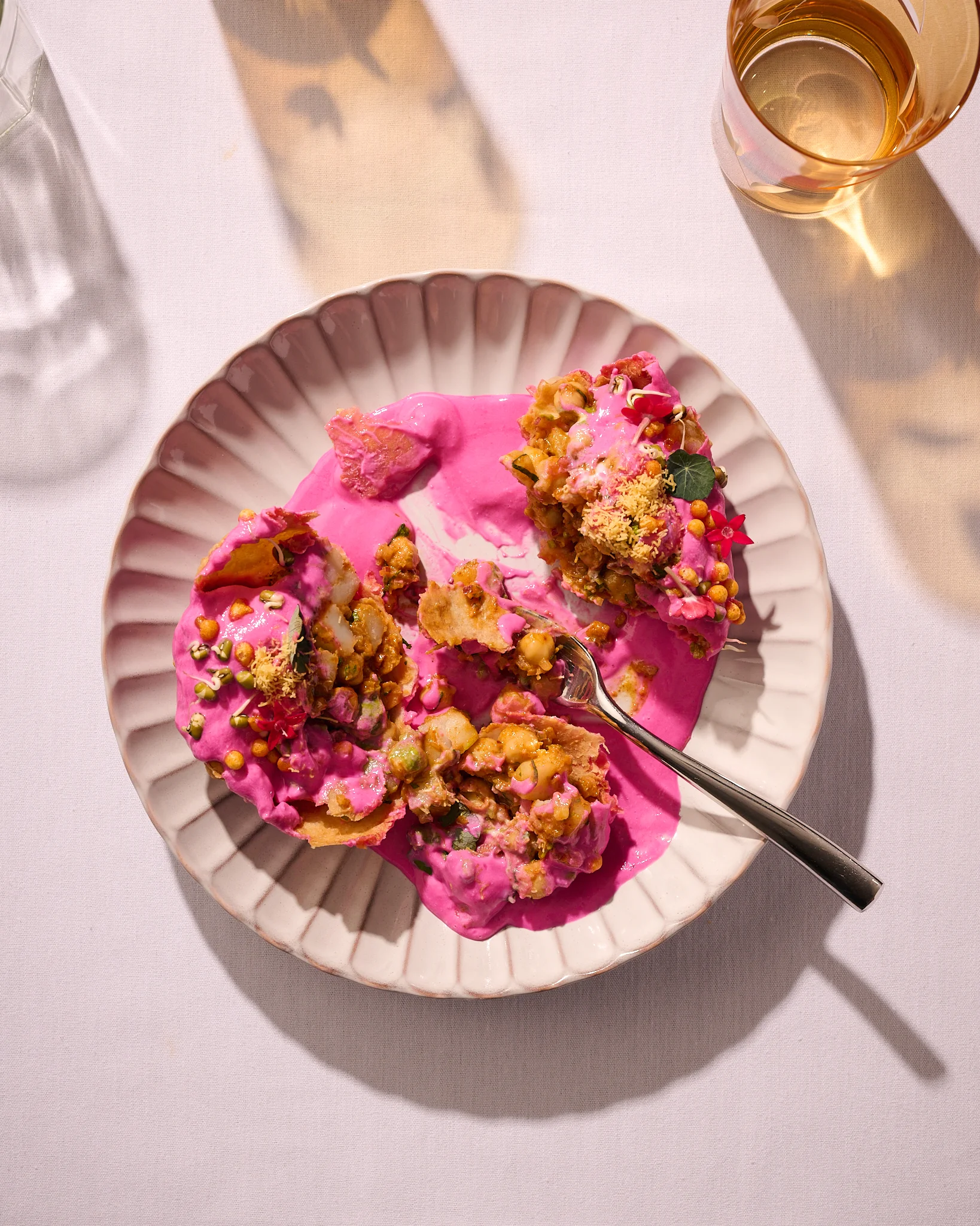 Colorful Indian dahi puri served on a decorative plate