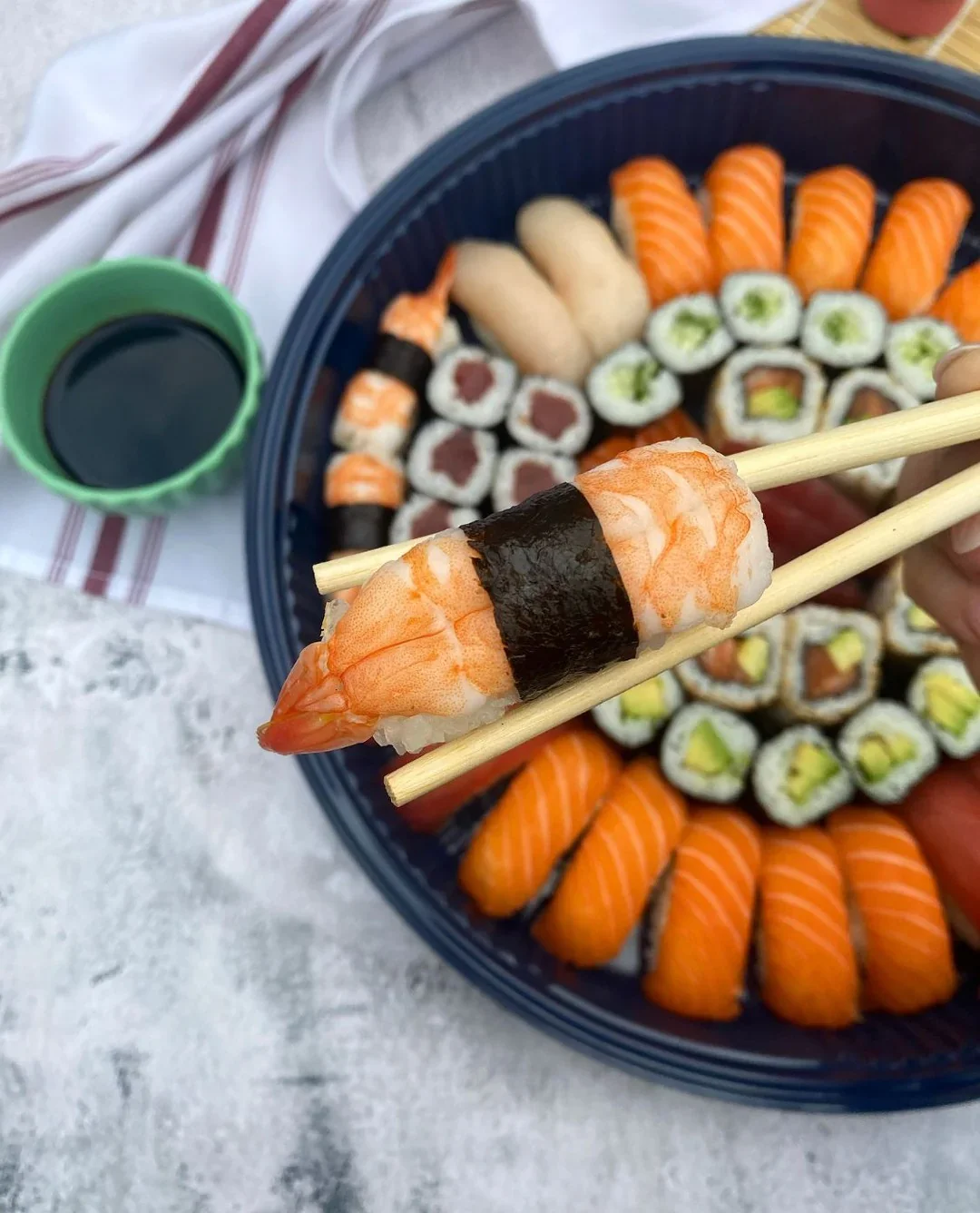 Assorted sushi platter featuring nigiri and rolls