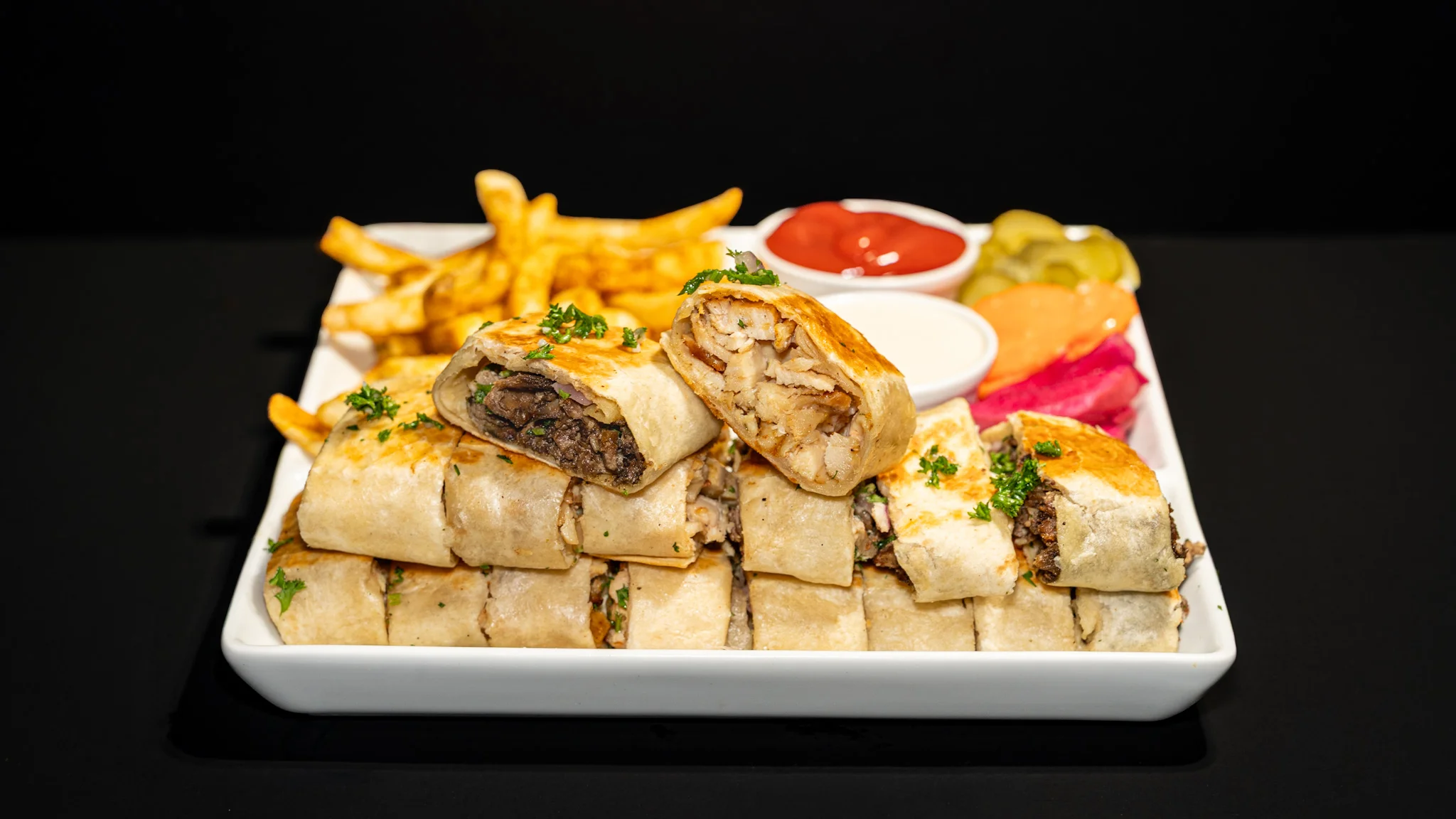 A delicious double mix of Arabic dishes served on a plate.