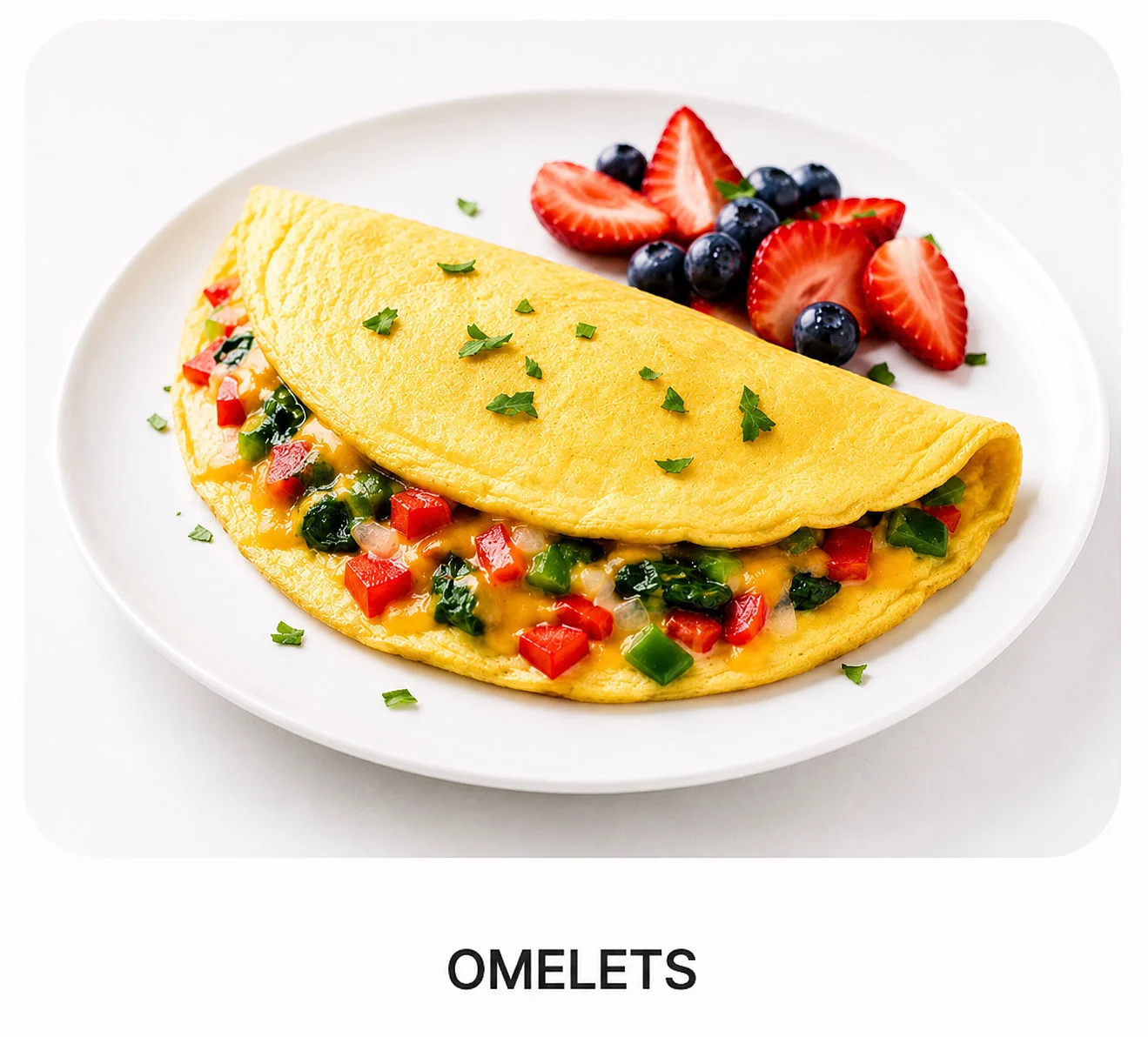 Fluffy omelet with vegetables and herbs on a white plate