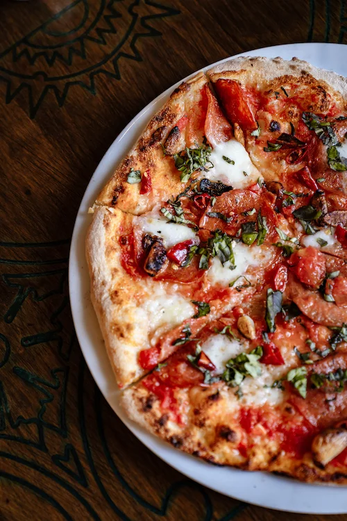 ImagDiavola Napoletano with Artisan Peeperoni, San Marzanos, Bufala Mozzarella, Roasted Garlic, Calabrian Peppers, Fresh Basil