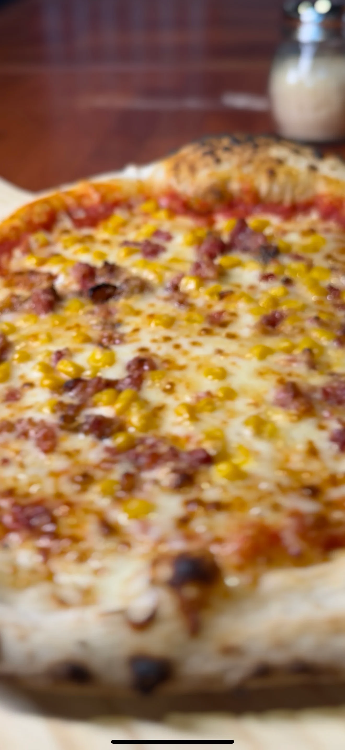Delicious pizza topped with cheese and savory meat