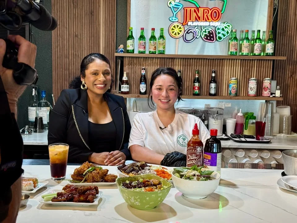 A mother and daughter preparing food at Mama Kim's