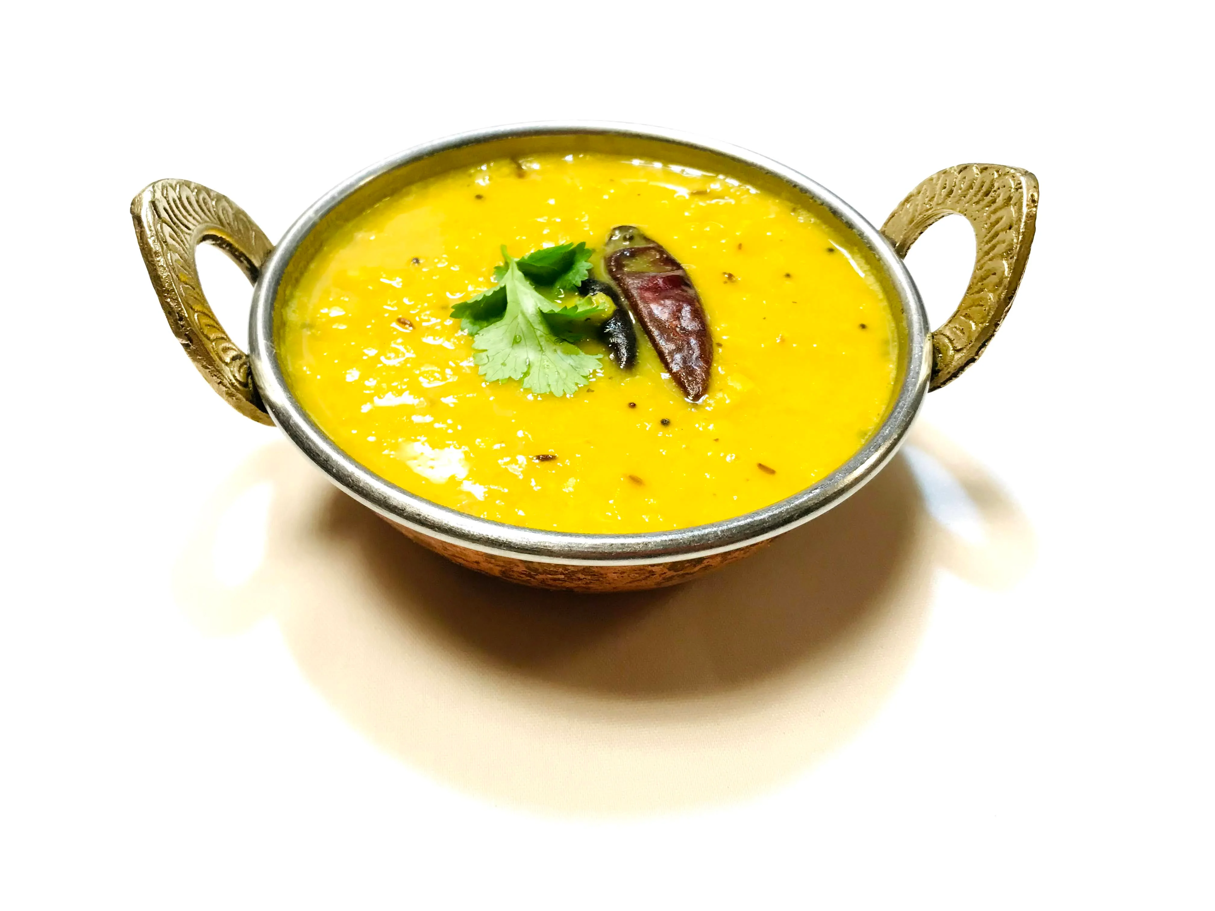Bowl of Indian dal with spices and cilantro garnish