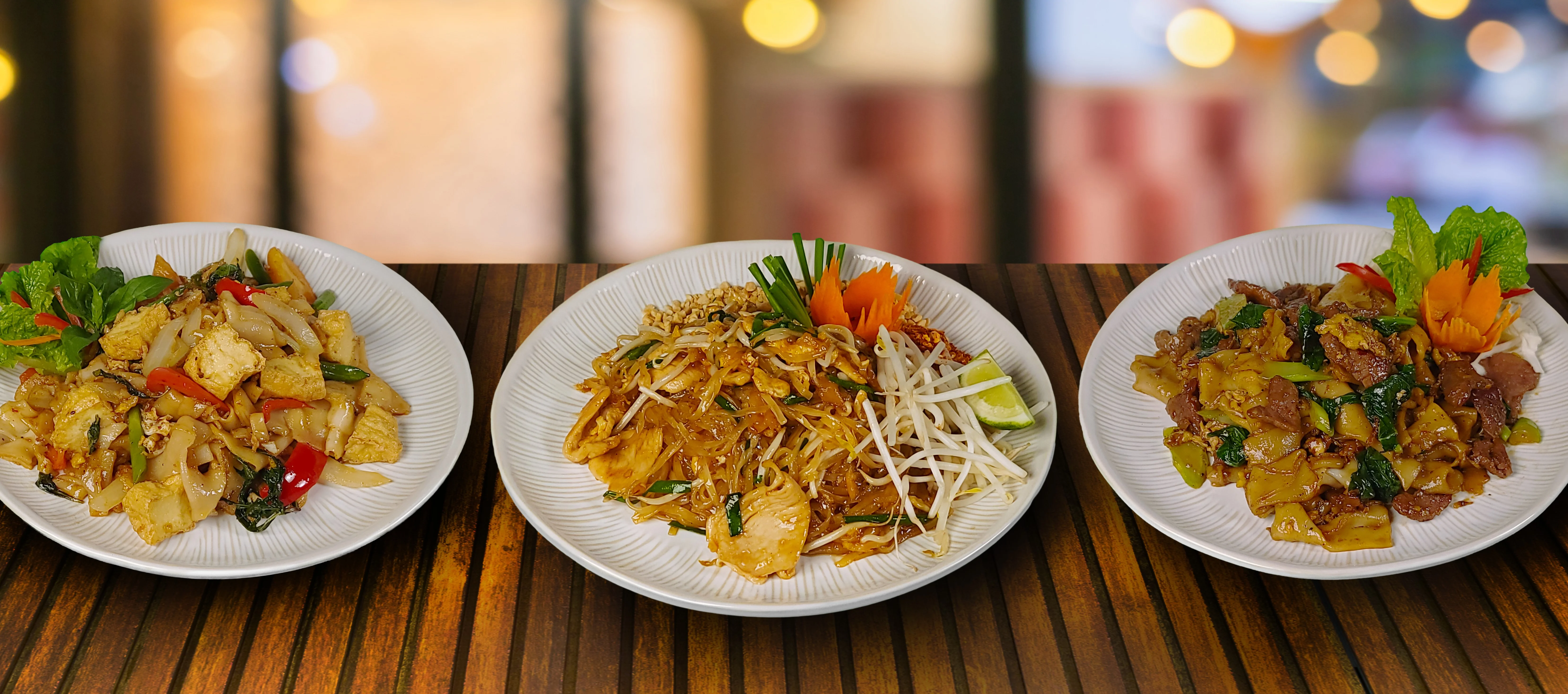 Three thai foid noodle dishes by Pink Bee.