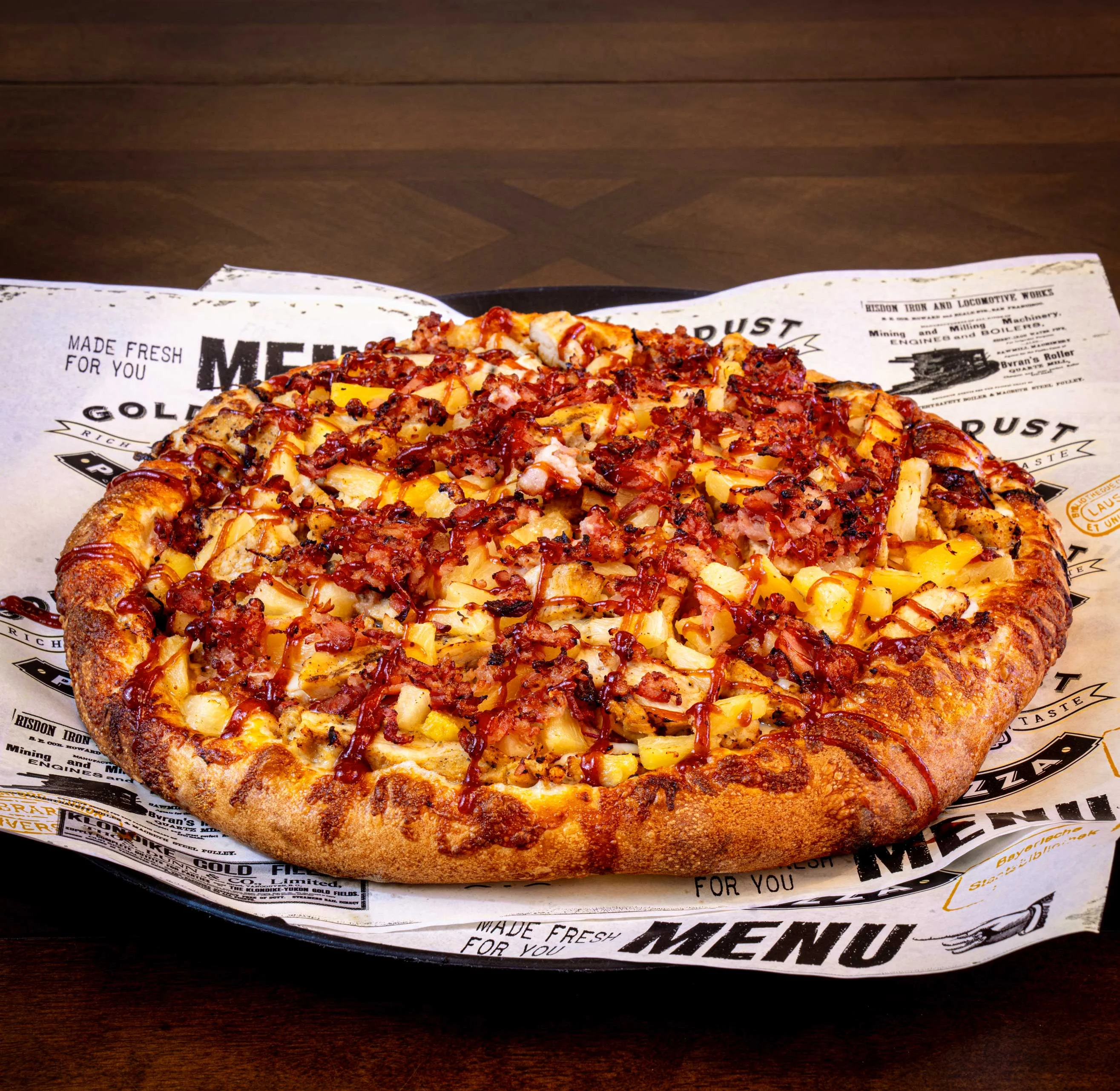 BBQ chicken pizza with pineapple and bacon