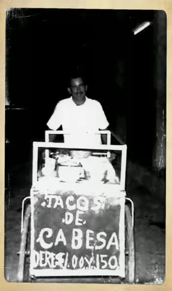 old black and white photo of Alfonso with a taco cart
