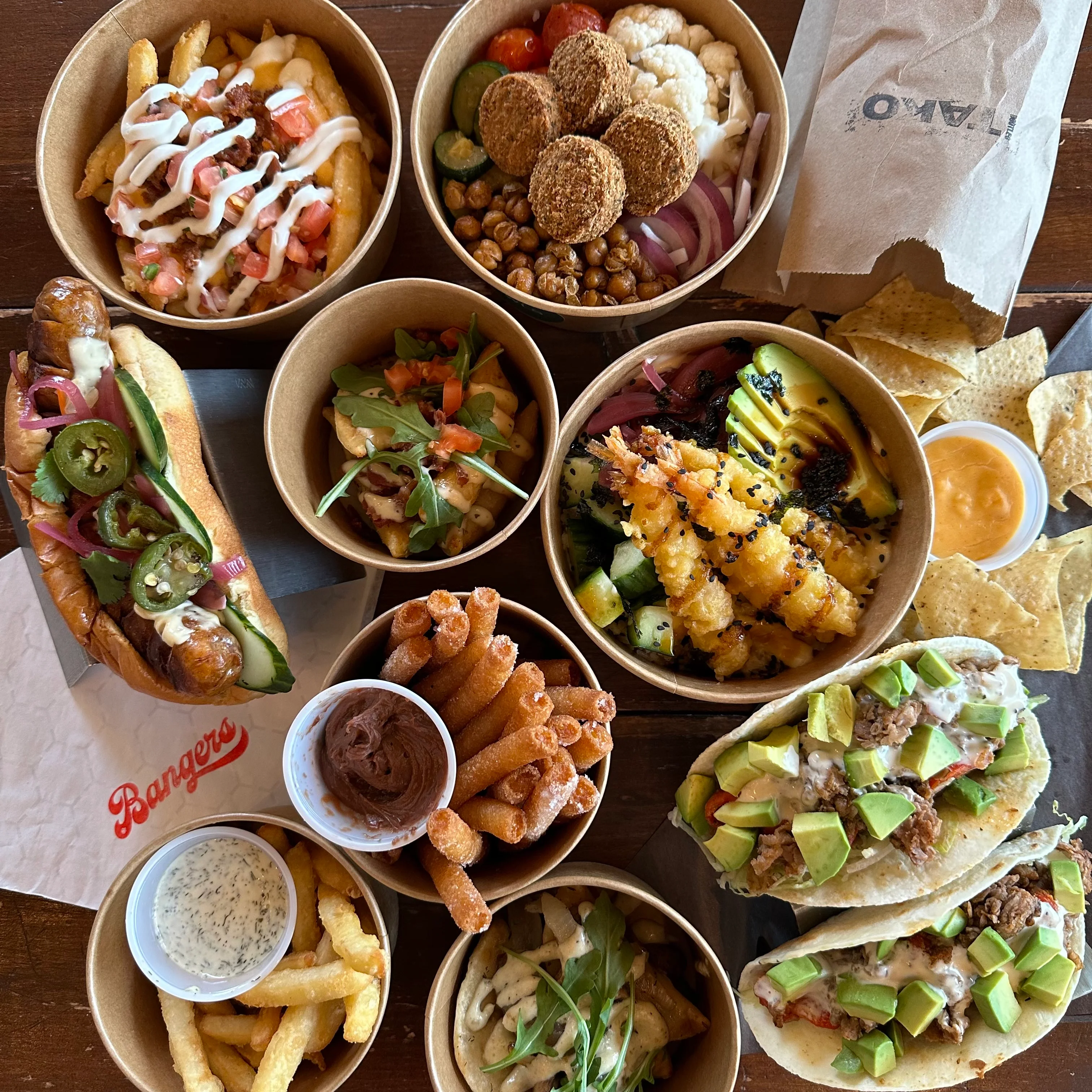 Assorted global street food including tacos and hot dogs
