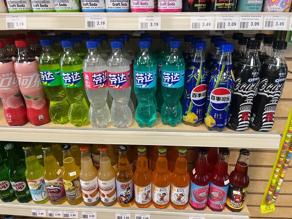 Variety of colorful soft drinks on store shelves