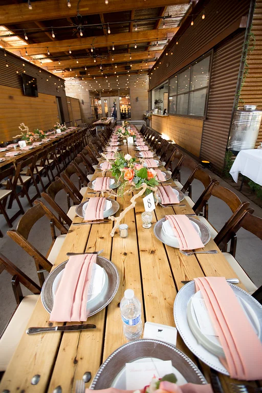 Elegant dining setup with floral centerpieces and soft lighting
