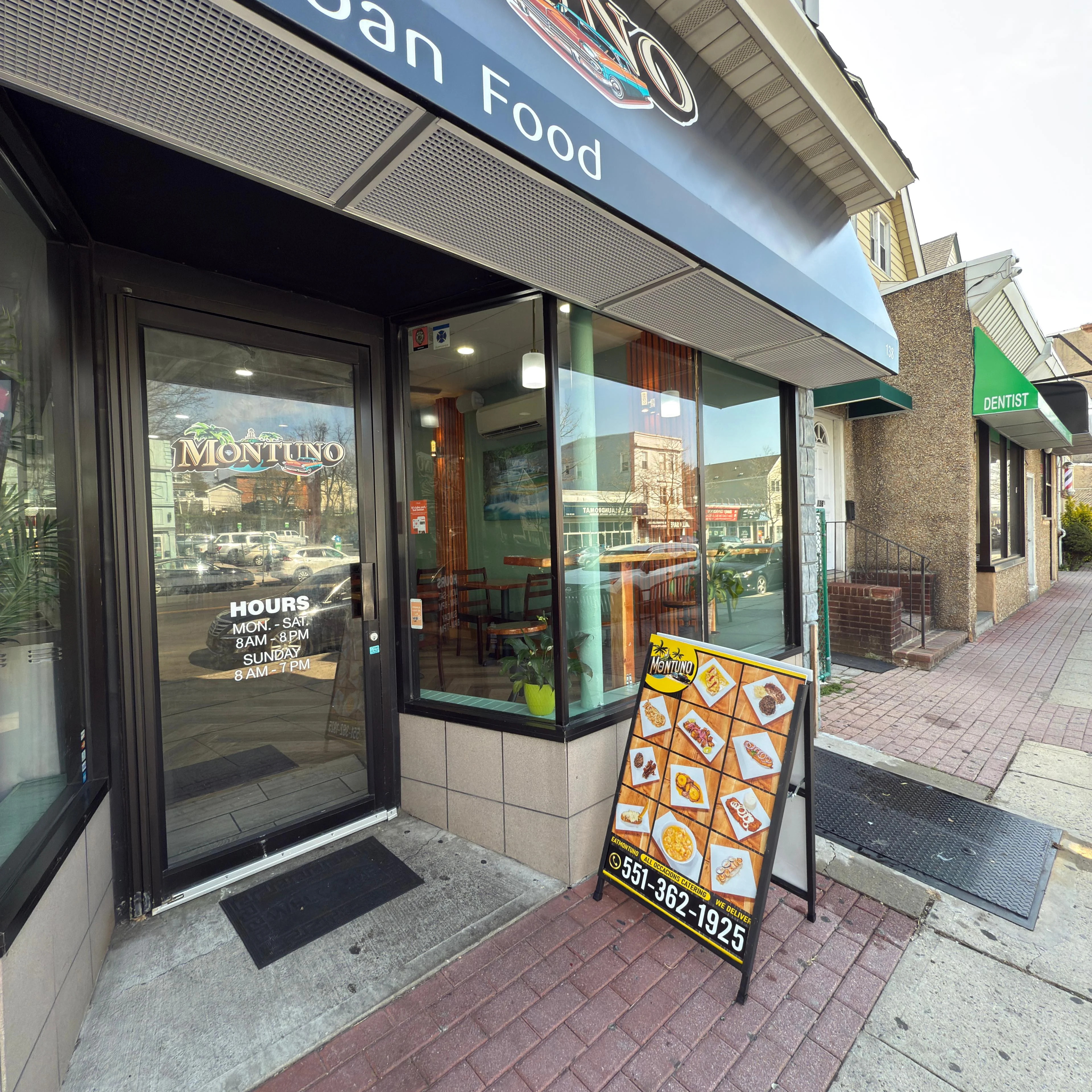 Exterior of Montuno Cuban Food restaurant with menu board