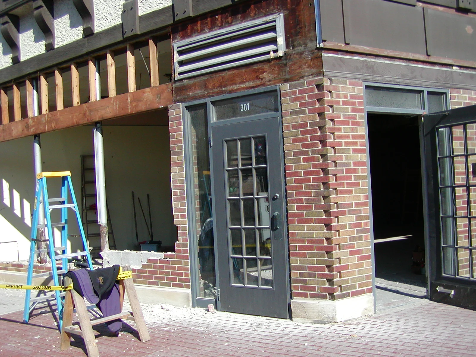 Construction site with exposed brick and scaffolding for a restaurant renovation