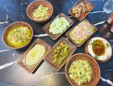 Mediterranean mezze platter with assorted dips and salads