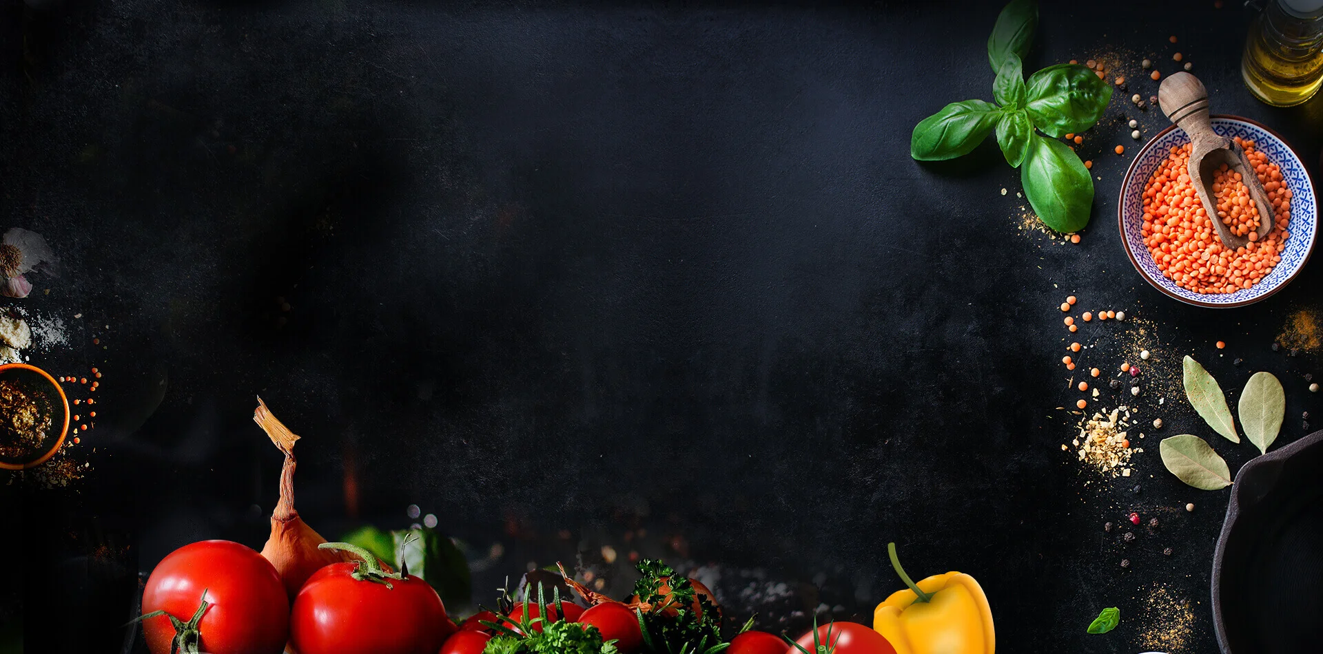 Fresh ingredients for Mediterranean cooking on a dark background