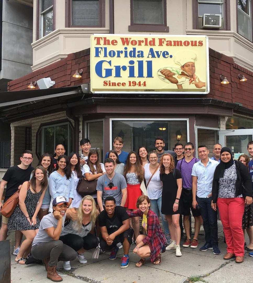 Group posing outside Florida Avenue Grill restaurant in Washington, DC