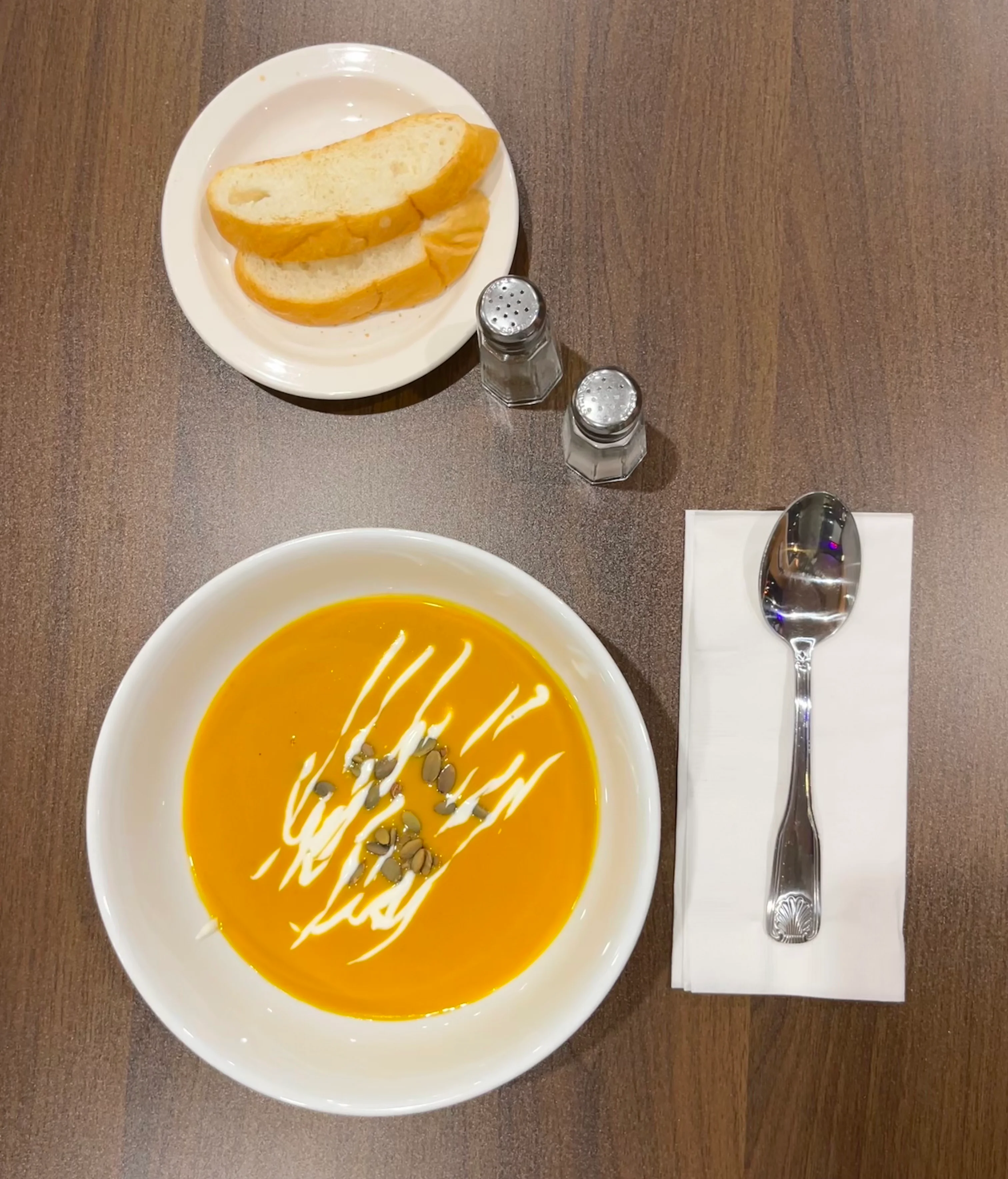 Creamy pumpkin soup garnished with seeds