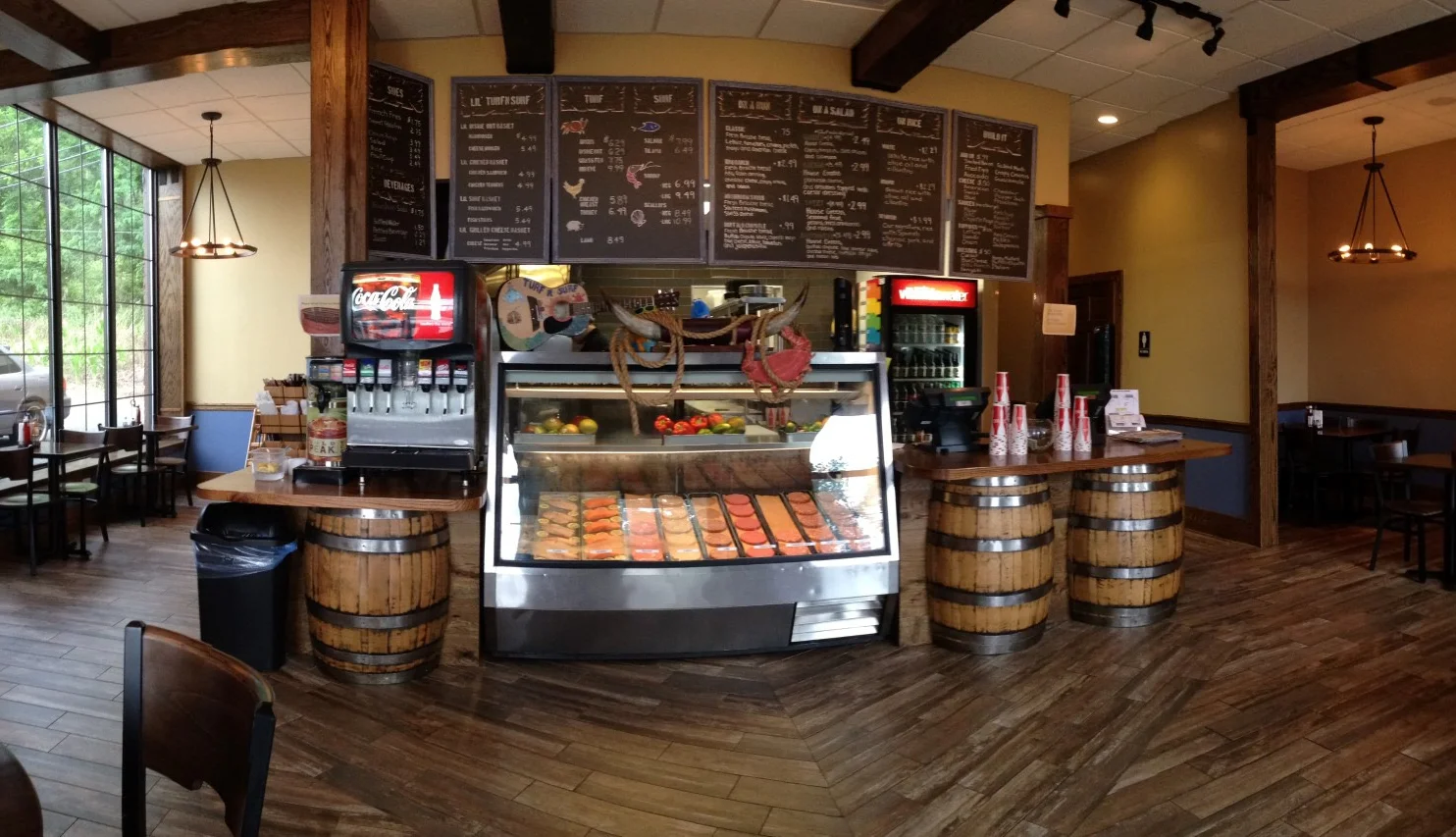 Cozy restaurant interior with wooden accents and menu board