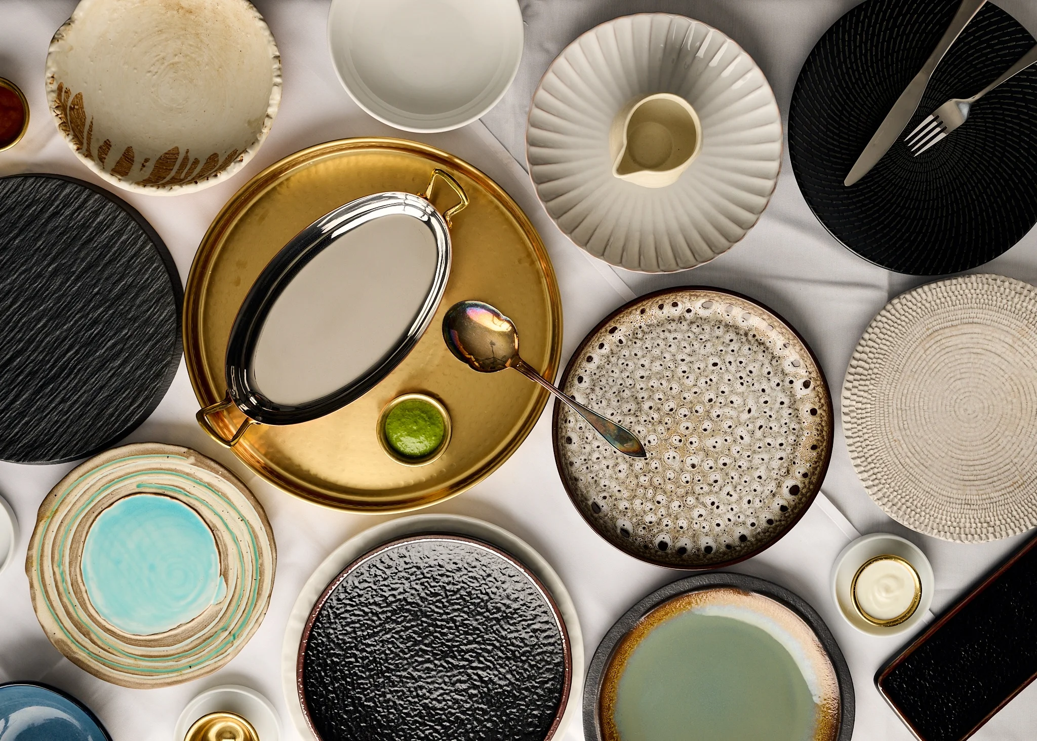 Elegant assortment of dining plates and serving dishes on a table