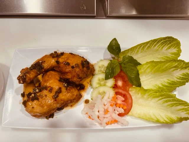 A restaurant chef preparing a dish