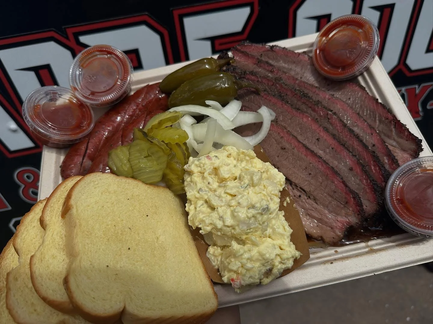 Texas-style barbecue platter with brisket and sausage