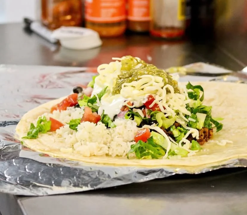 Loaded burrito with fresh toppings and salsa