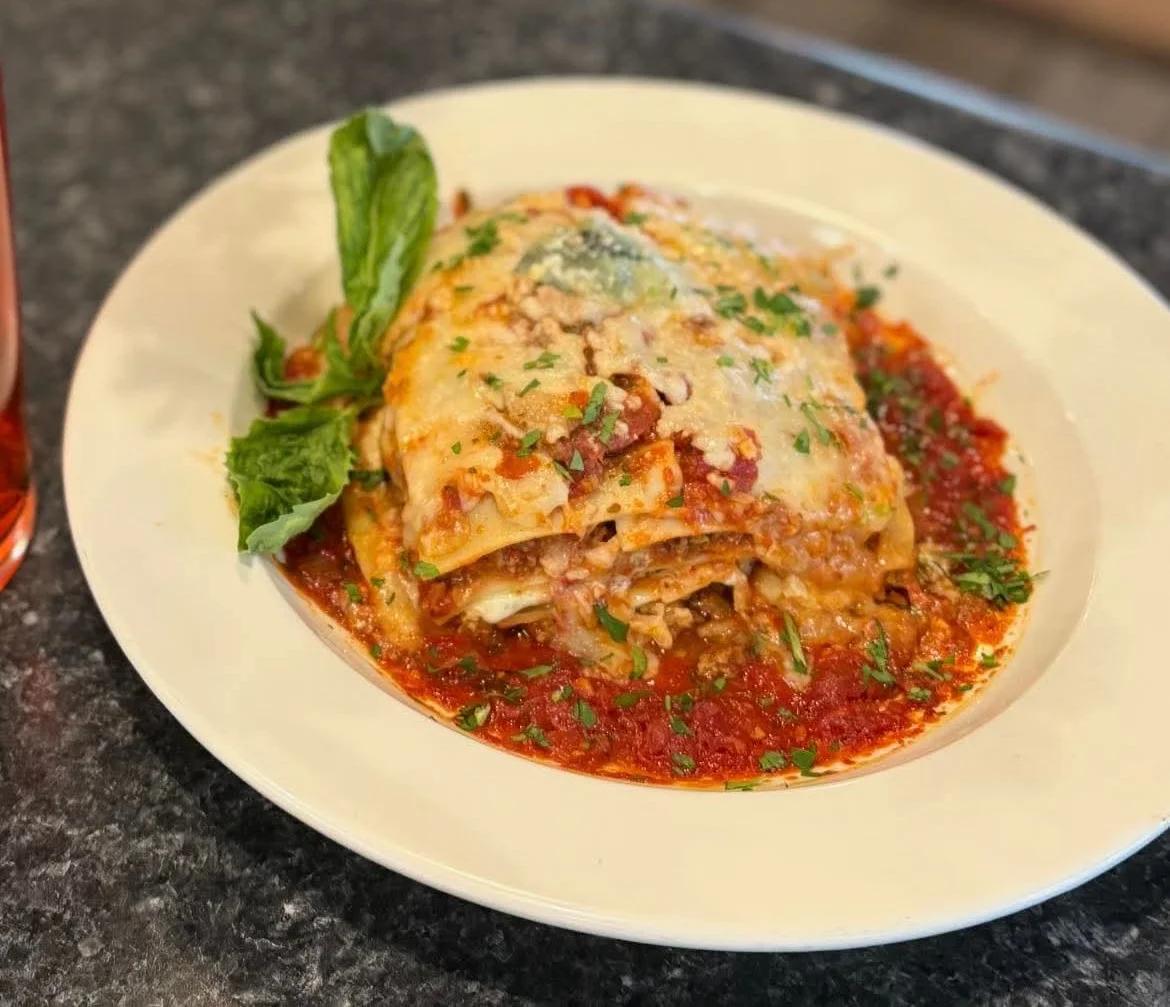 Delicious Italian lasagna served with marinara sauce
