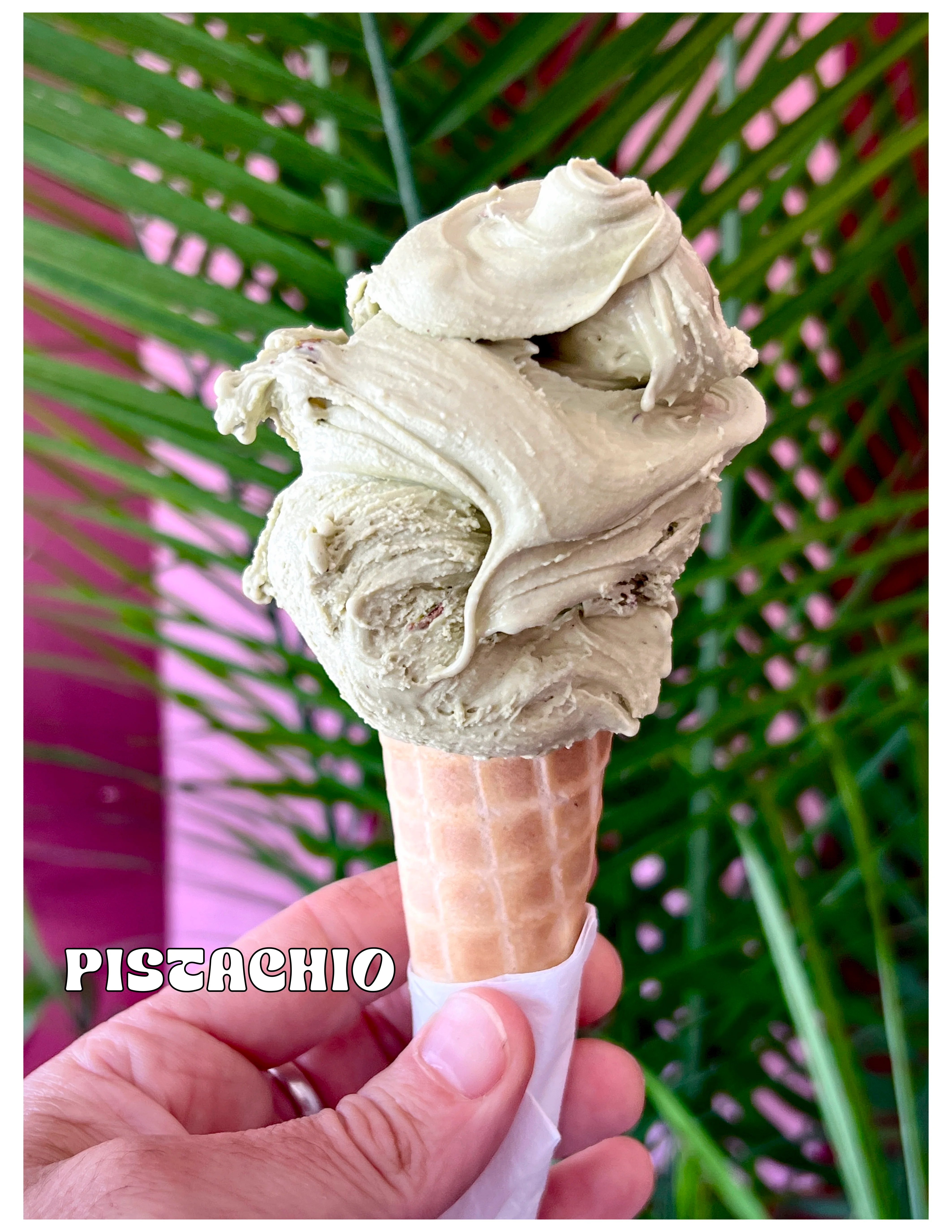 Pistachio gelato served in a waffle cone