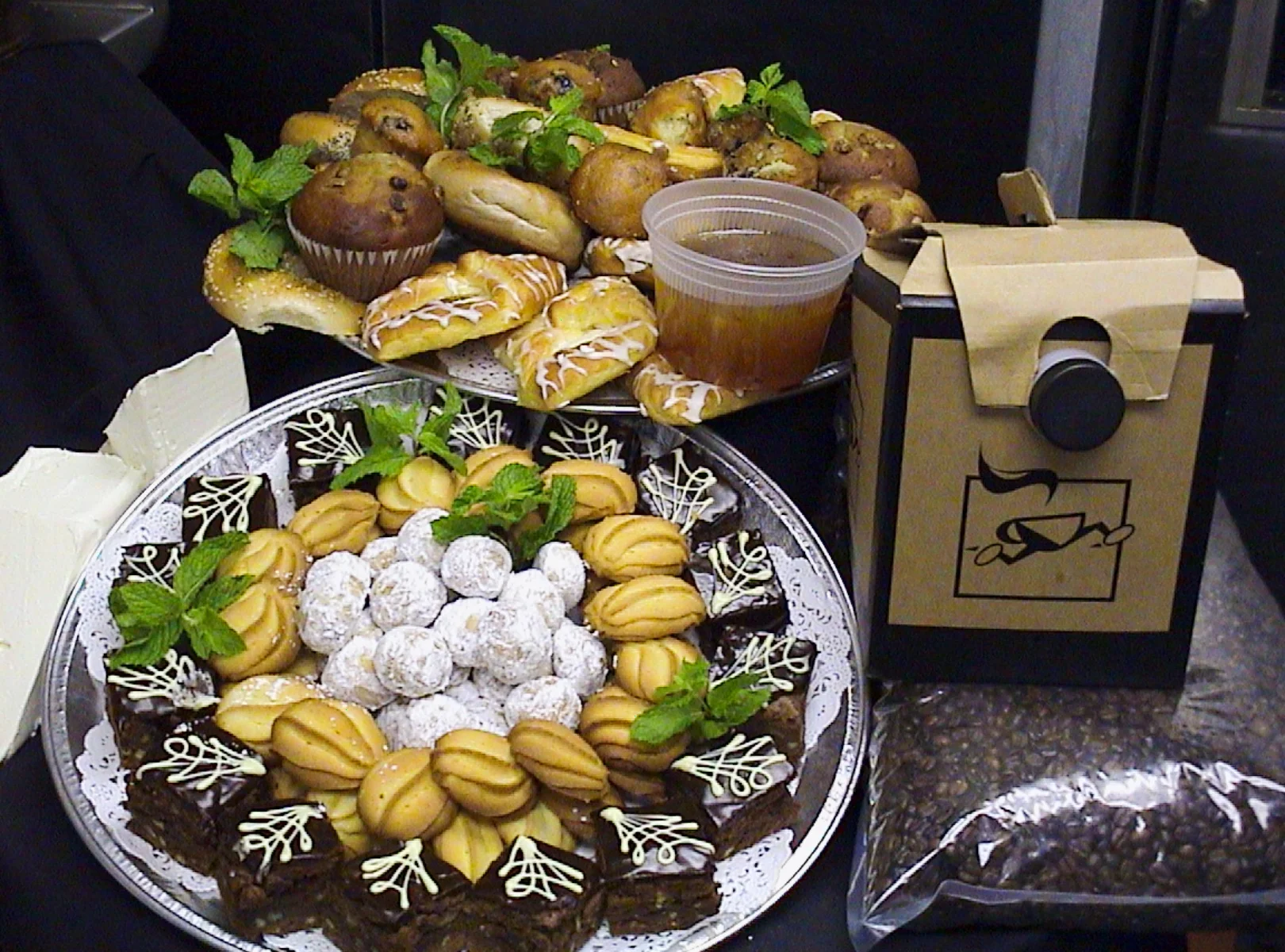 Corporate breakfast takeout spread from Post Oak Grill Downtown Houston featuring baked goods , fruit, and coffee.