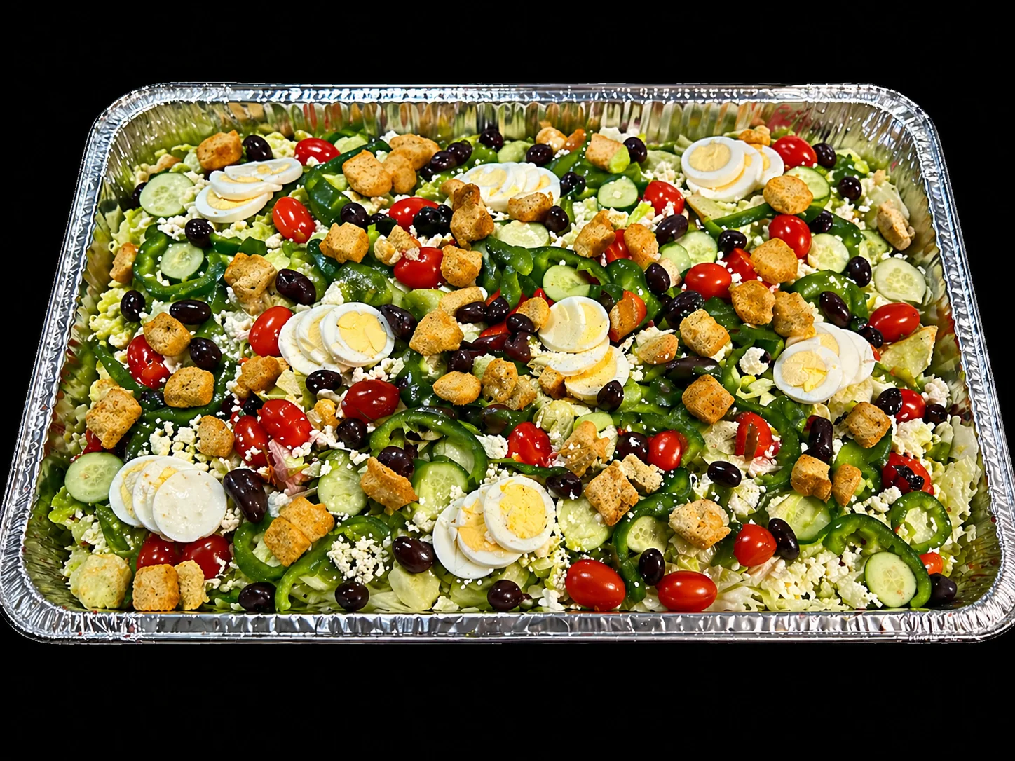 Colorful Mediterranean salad platter with eggs and croutons