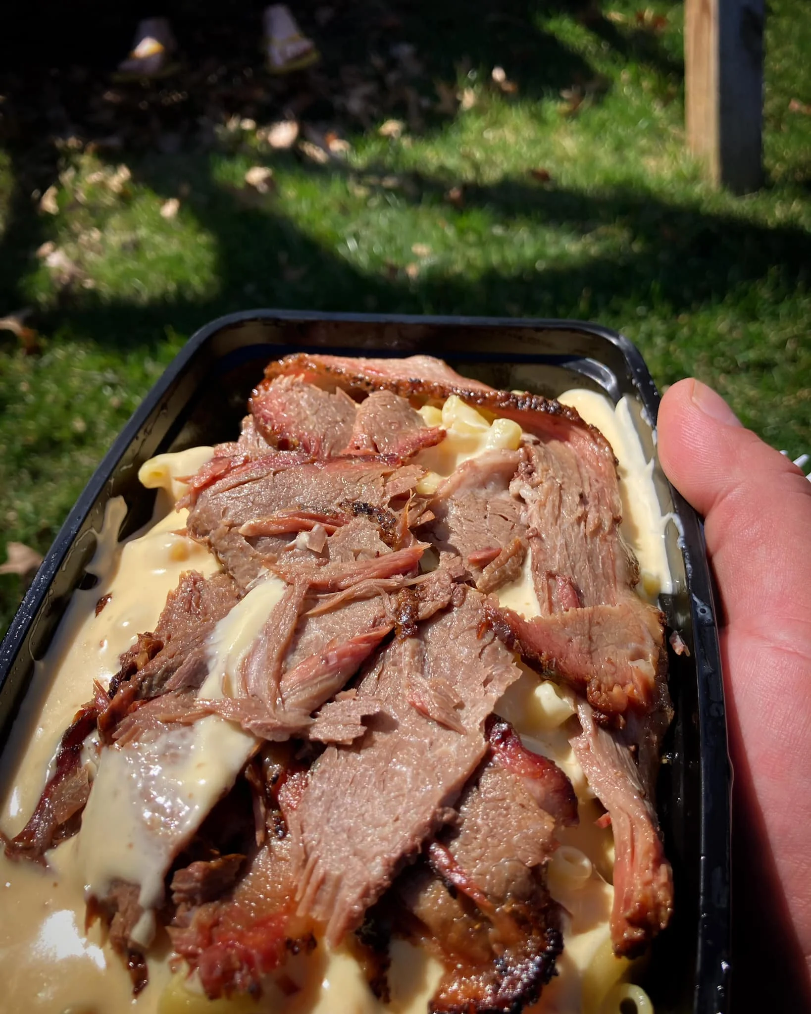Smoky brisket over creamy mac and cheese