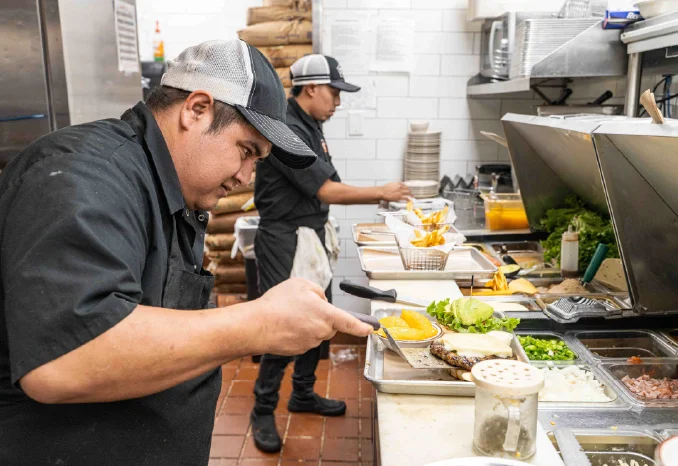 A restaurant chef preparing a dish