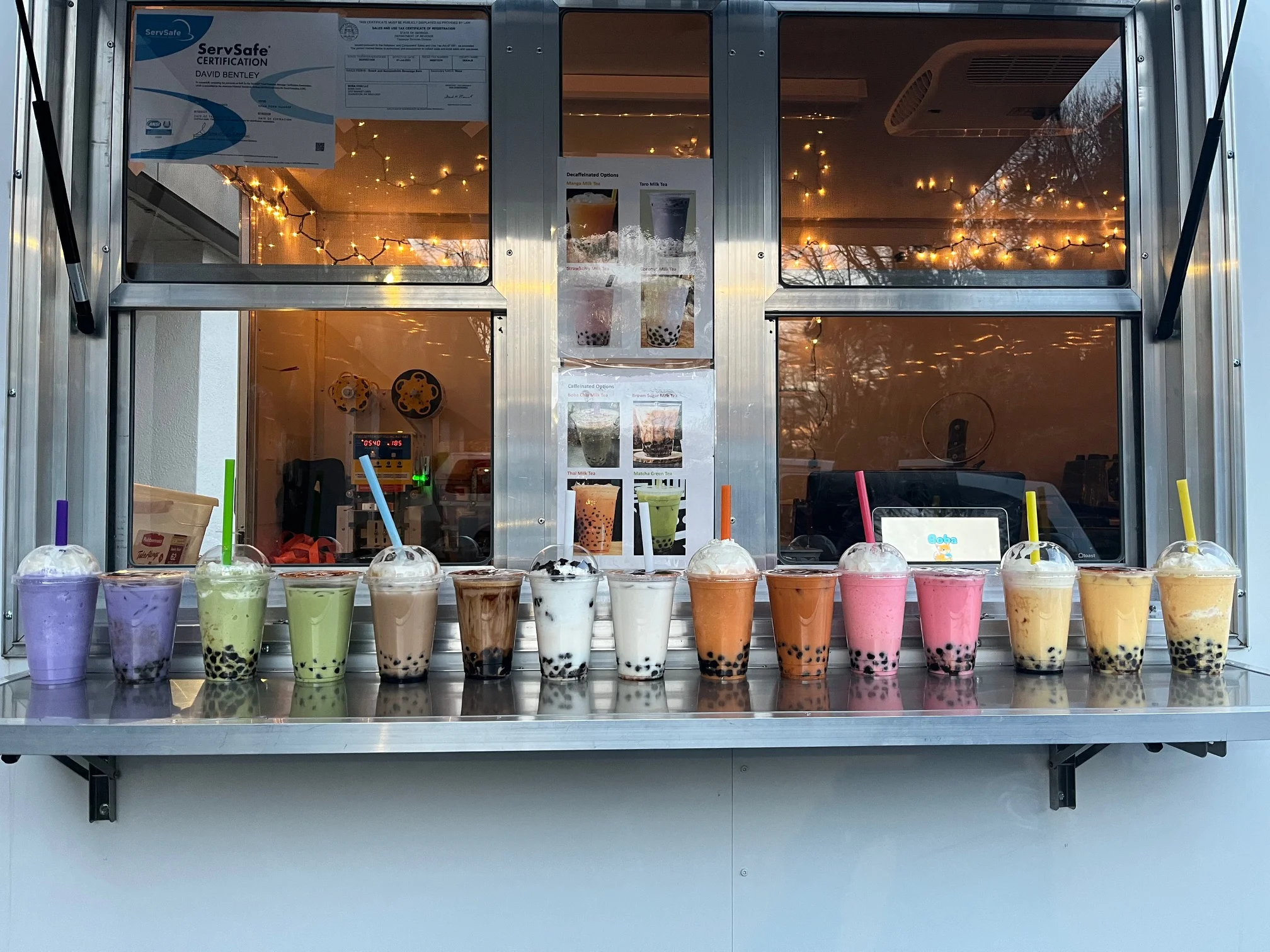 Colorful selection of bubble tea drinks in a food truck