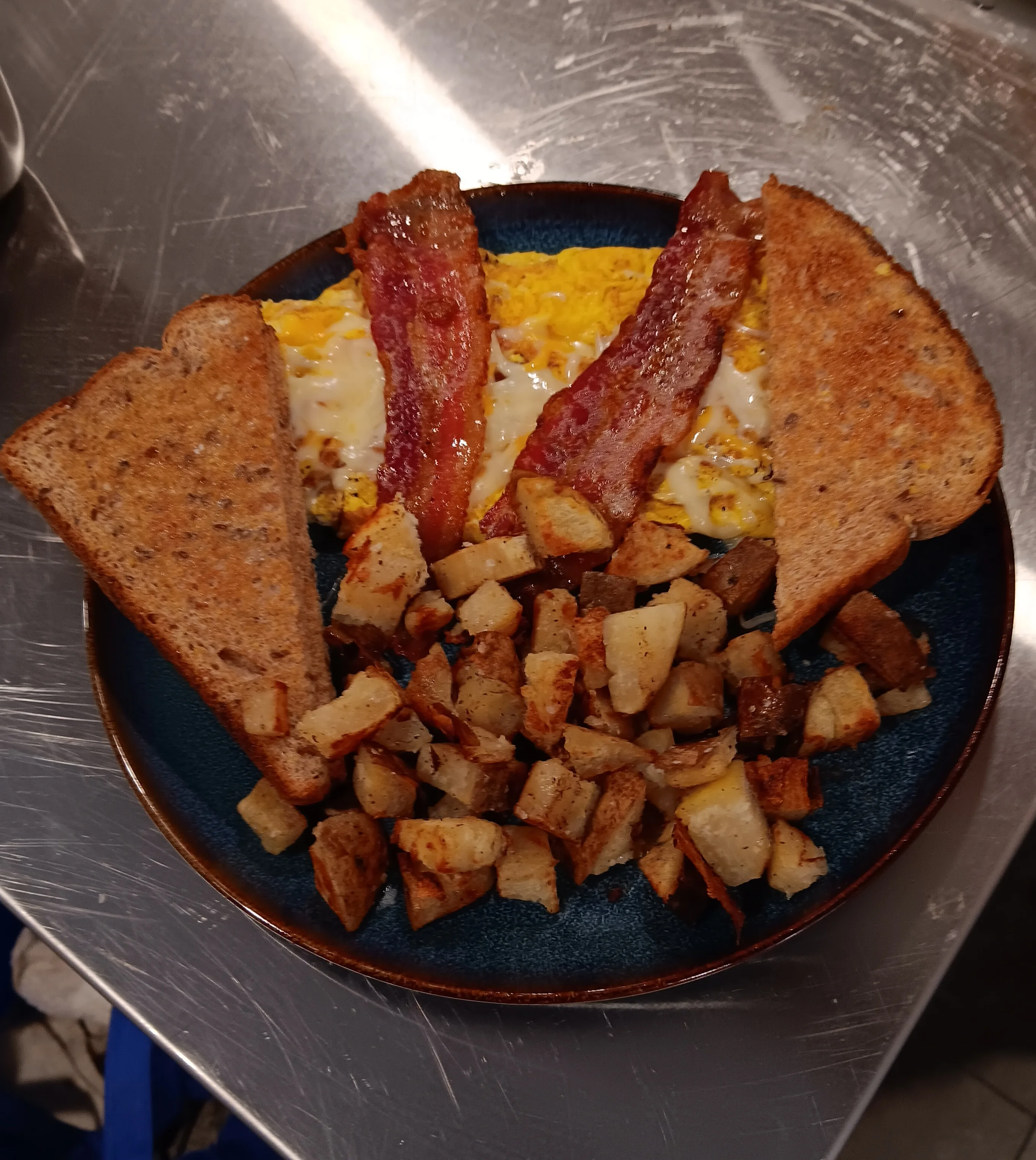 Classic American breakfast with eggs, bacon, and toast