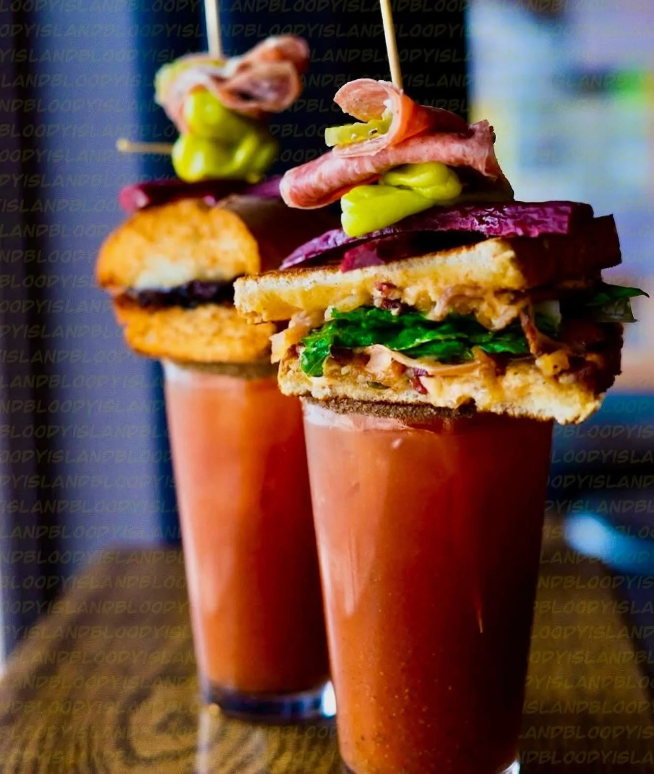 Bloody Mary with gourmet garnishes and sandwich skewers