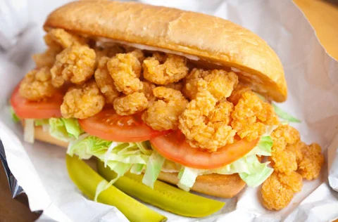 Delicious gourmet burger with fresh toppings on a wooden table