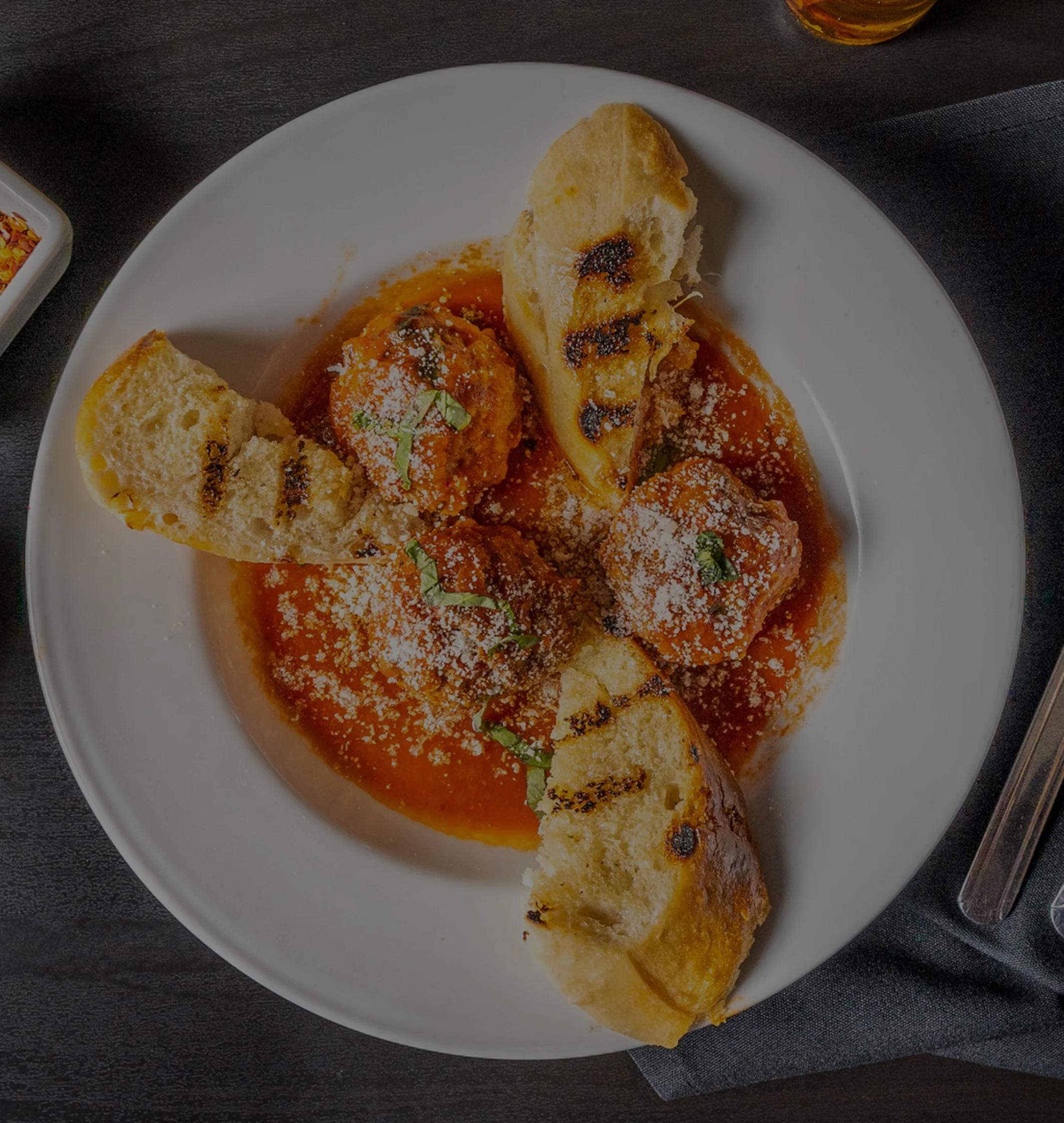 Plate of Meatballs and bread in sauce