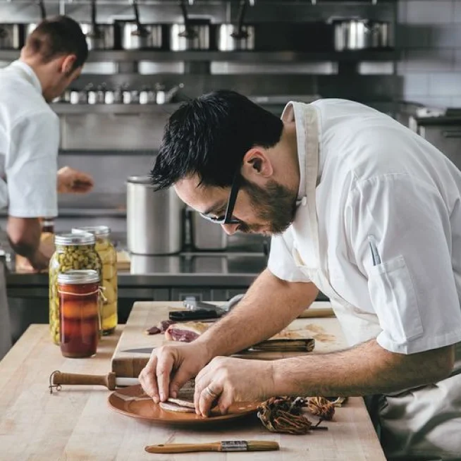 A restaurant chef preparing a dish