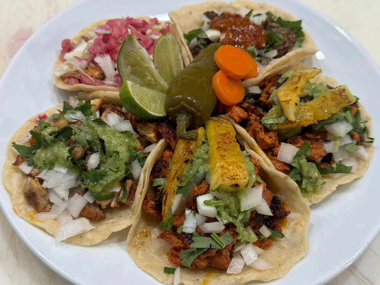 Assorted Mexican street tacos with vibrant toppings