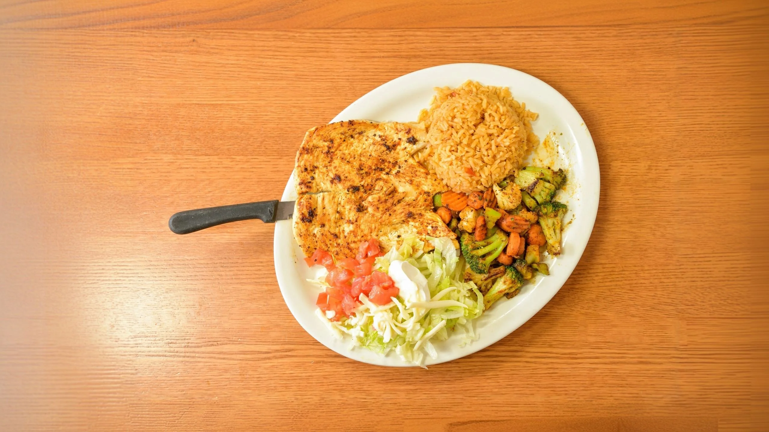 Grilled fish platter with rice and vegetables