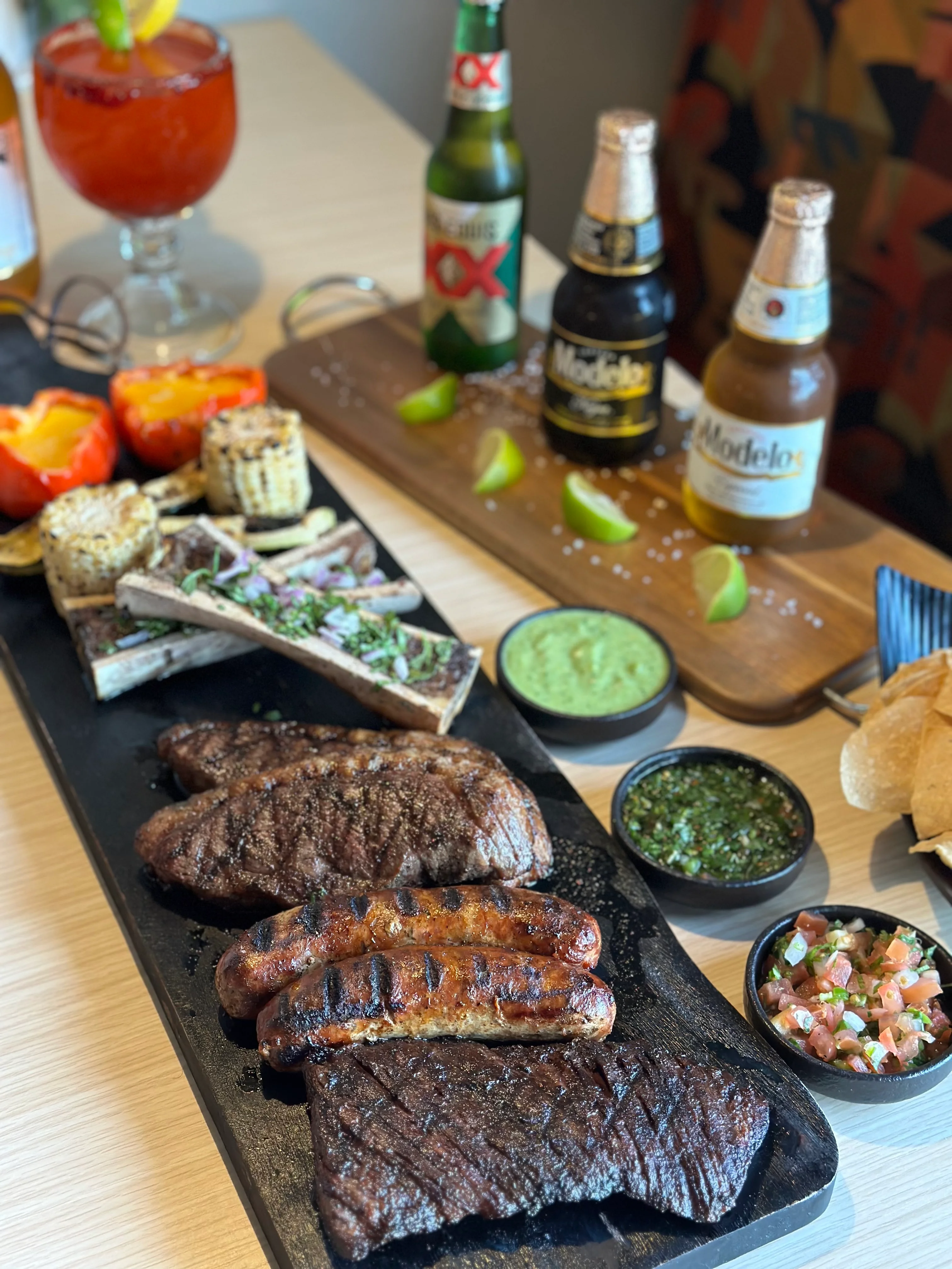 Sizzling Mexican parrillada with grilled meats and sides