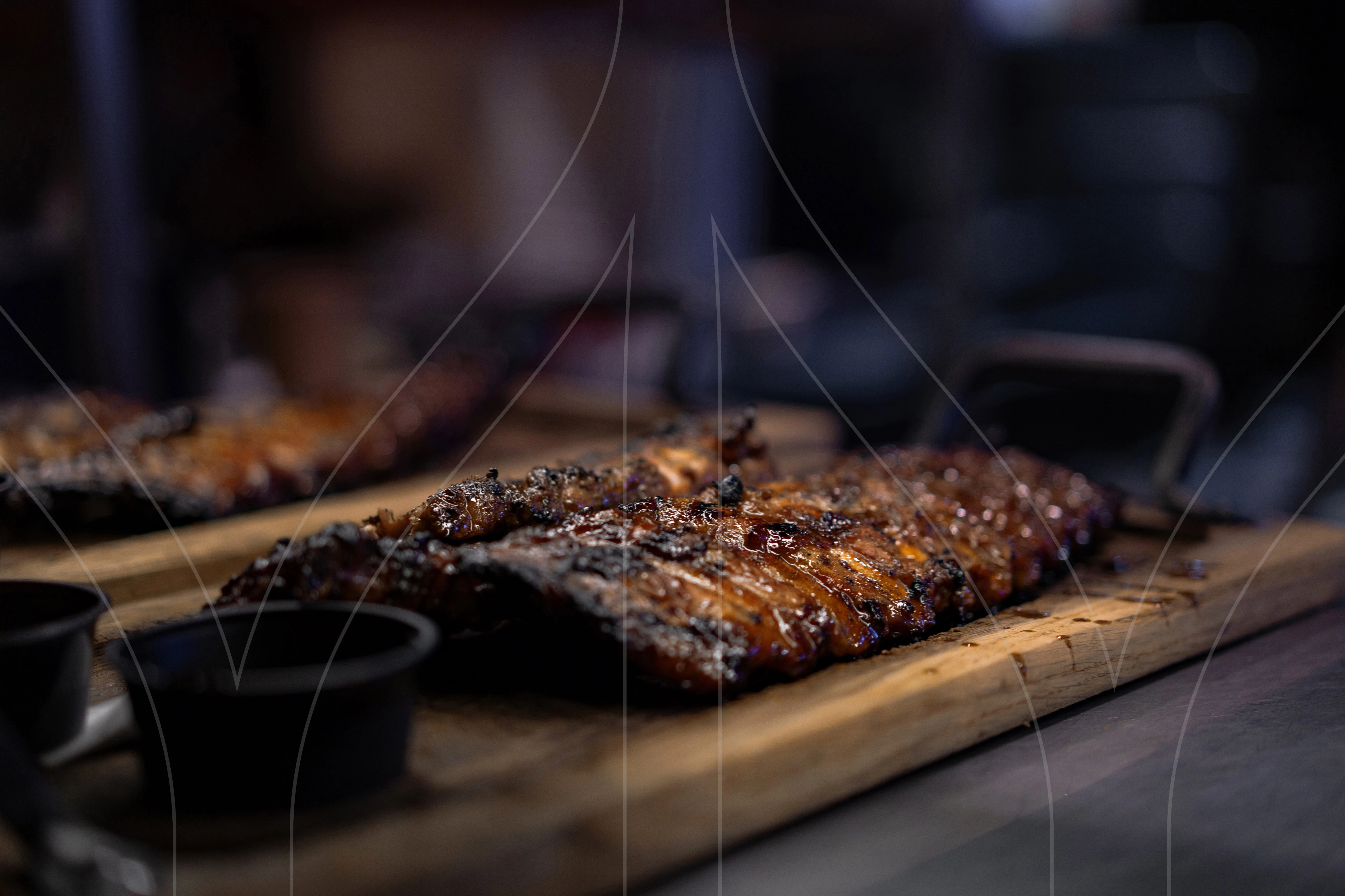 Smoky barbecue ribs served on a wooden platter