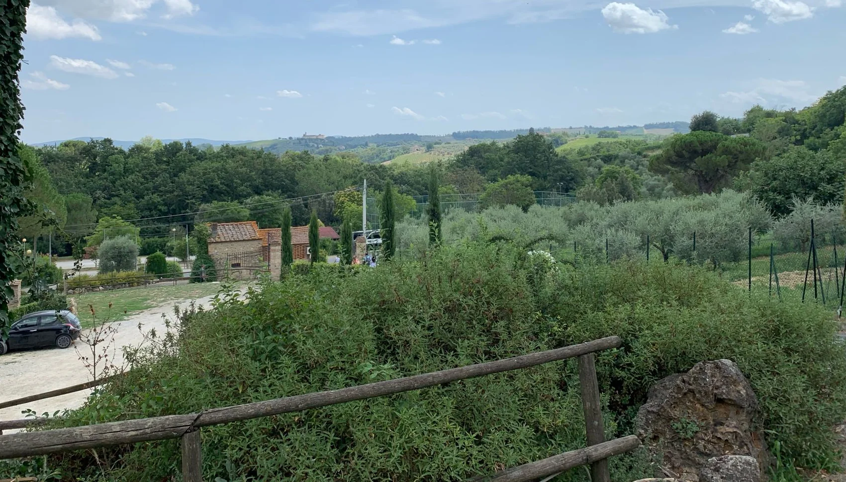 Scenic view of lush countryside with rolling hills and trees