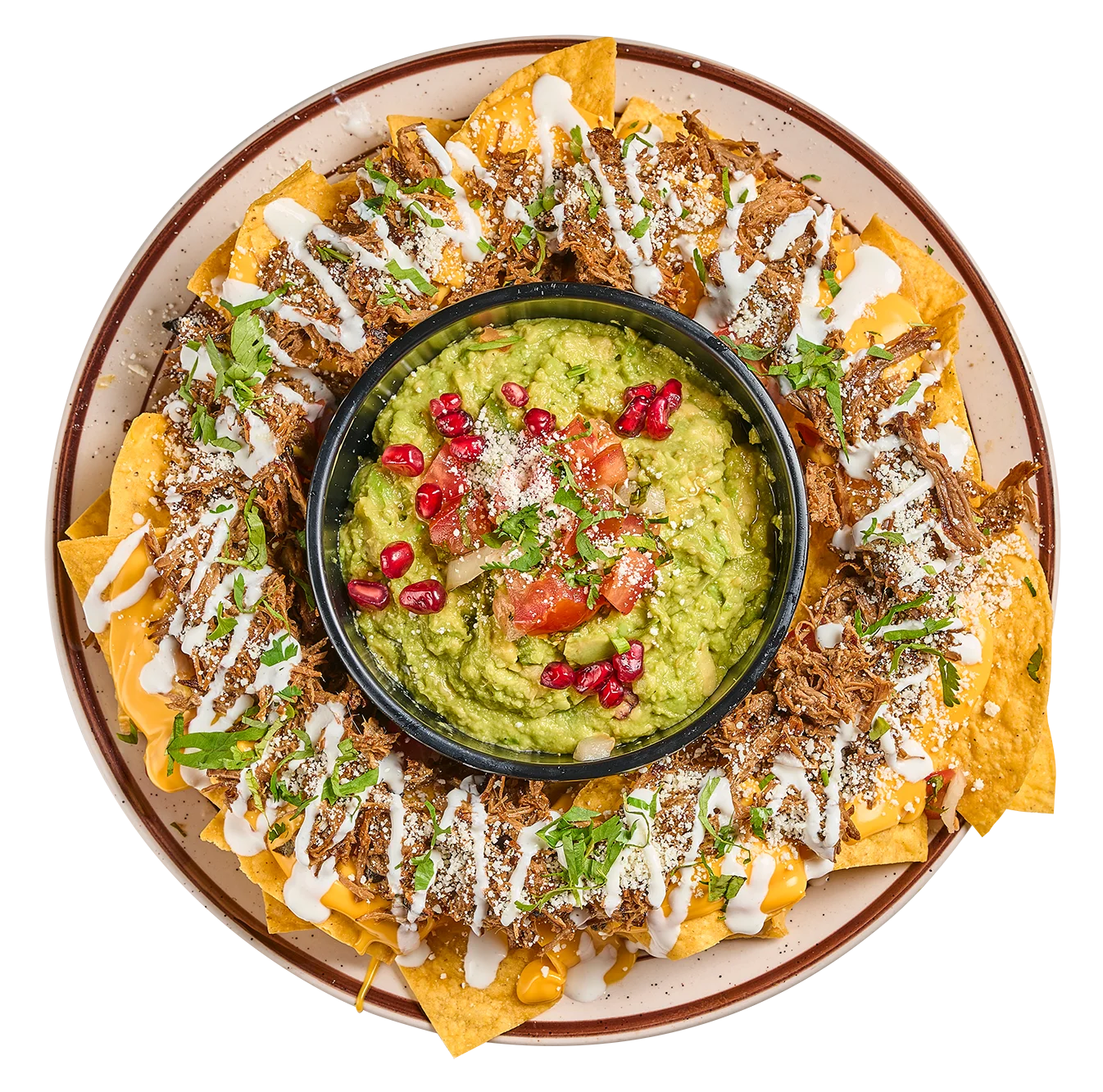 Mexican nachos topped with guacamole, shredded meat, crema and fresh garnishes at Catrina Querida in Doral