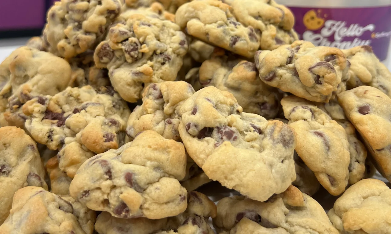 Freshly baked chocolate chip cookies stacked high