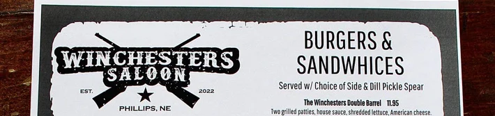 Menu from Winchester's Saloon featuring burgers and starters