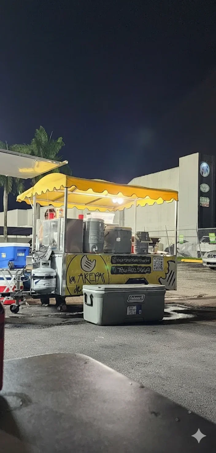Food cart serving Venezuelan arepas at night