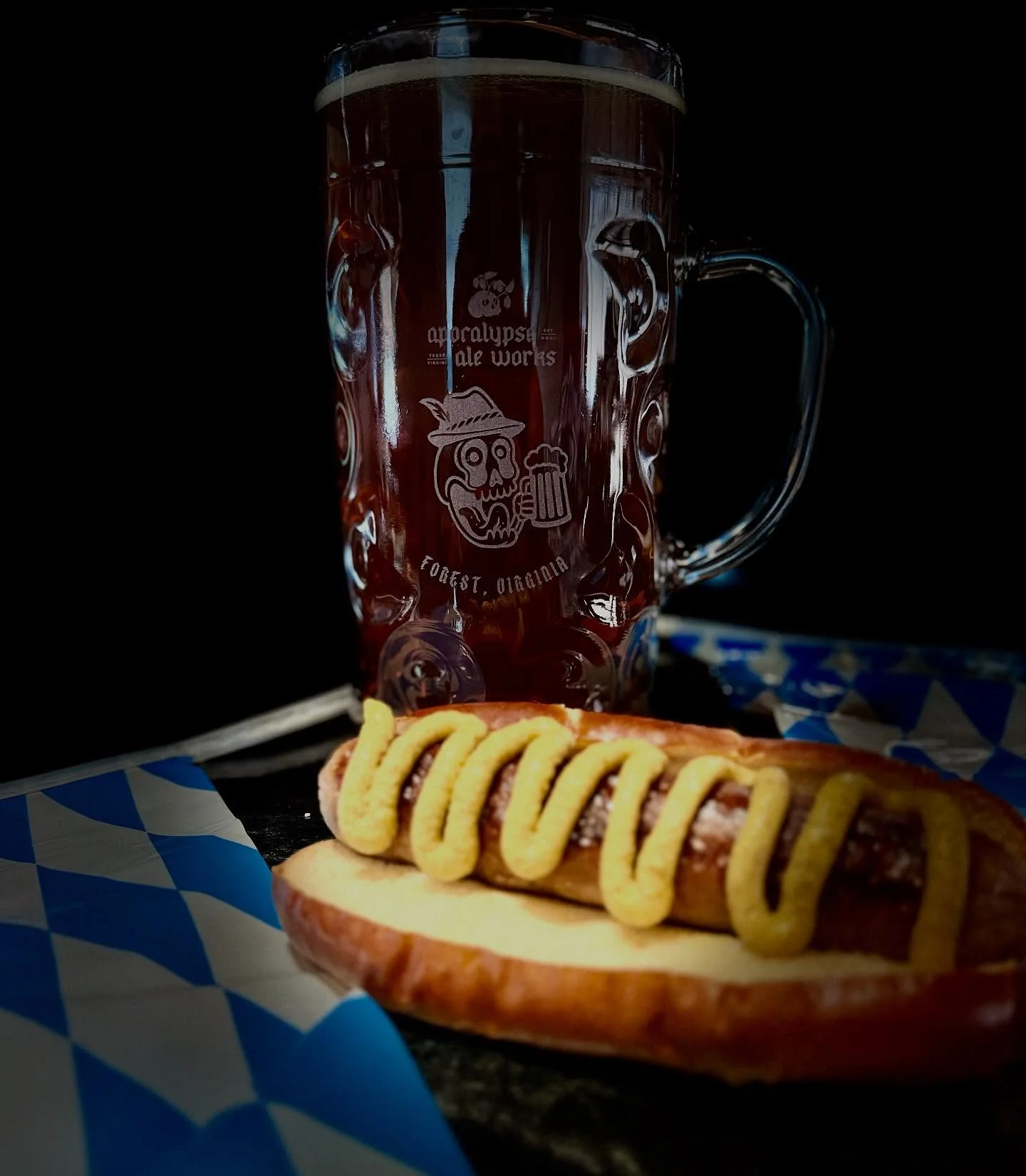 German bratwurst with mustard and a dark beer