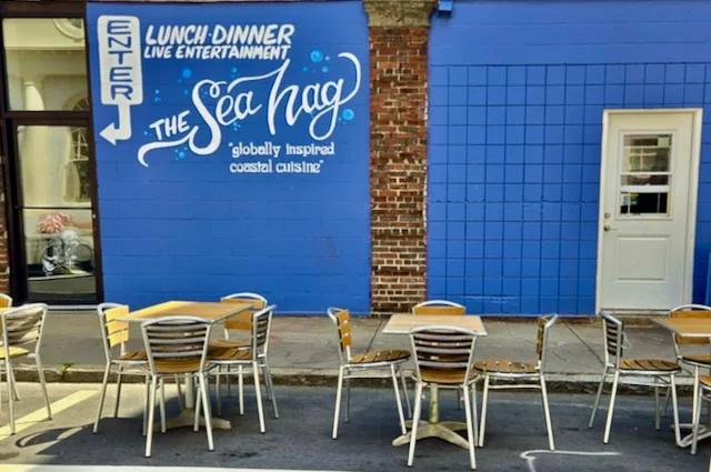 Exterior of The Sea Hag restaurant with coastal cuisine signage